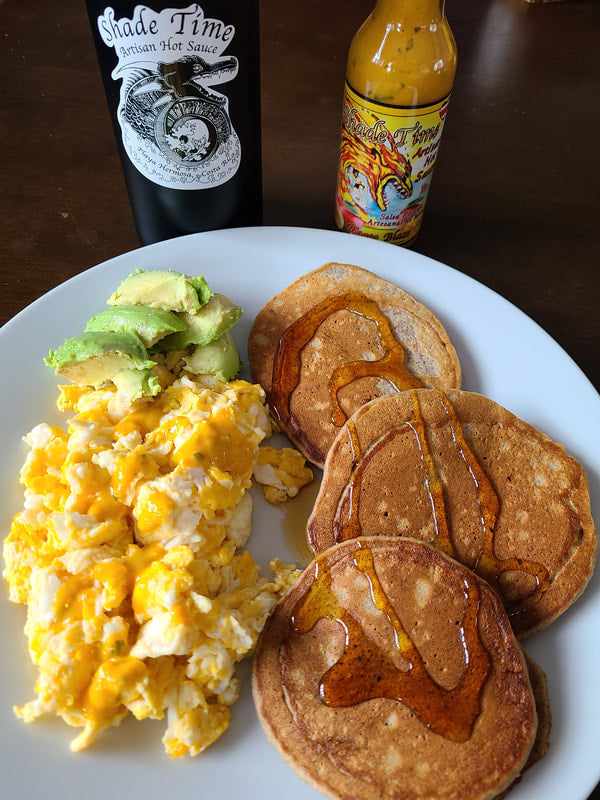 "Medium heat mango-based artisan hot sauce by Shade Time"