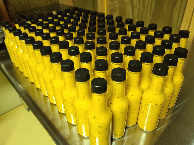 "Medium hot sauce with tropical flavor and Scotch Bonnet peppers"